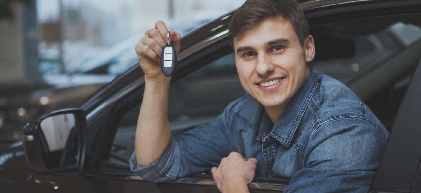 young man buying car