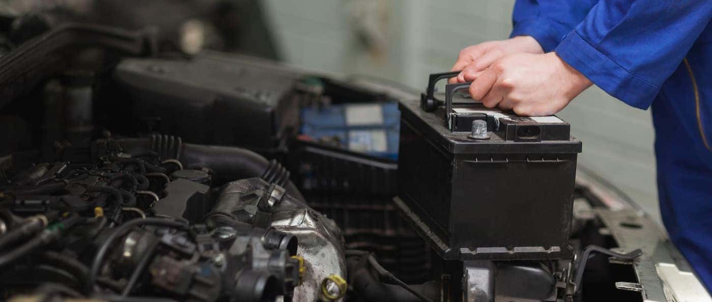 mechanic changing a car battery