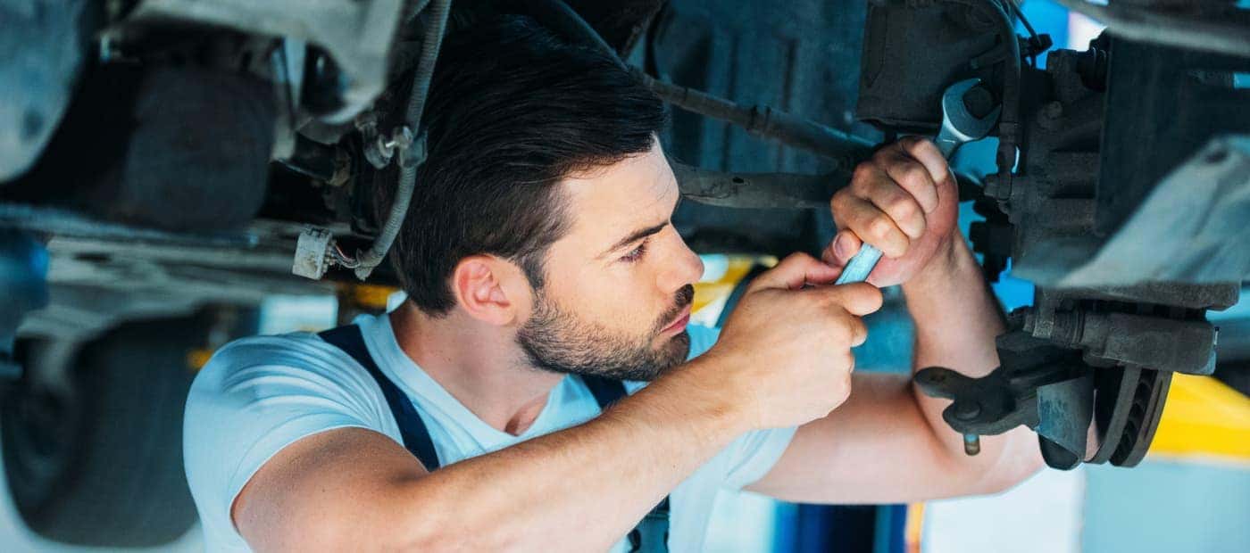 auto mechanic performing tune up