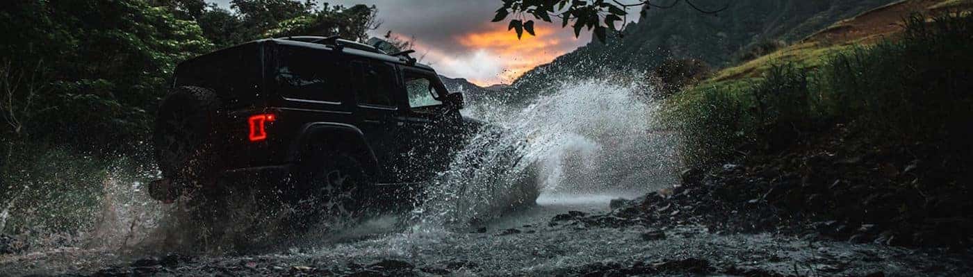 https://di-uploads-pod13.dealerinspire.com/gulfgatedcjr/uploads/2020/05/Jeep-Wrangler-off-roading-through-water.jpg