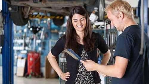Mechanic Talking to Woman