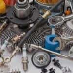 Pile of car parts spread out on a table