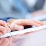 Man signing finance papers