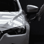 Woman getting into a Mazda