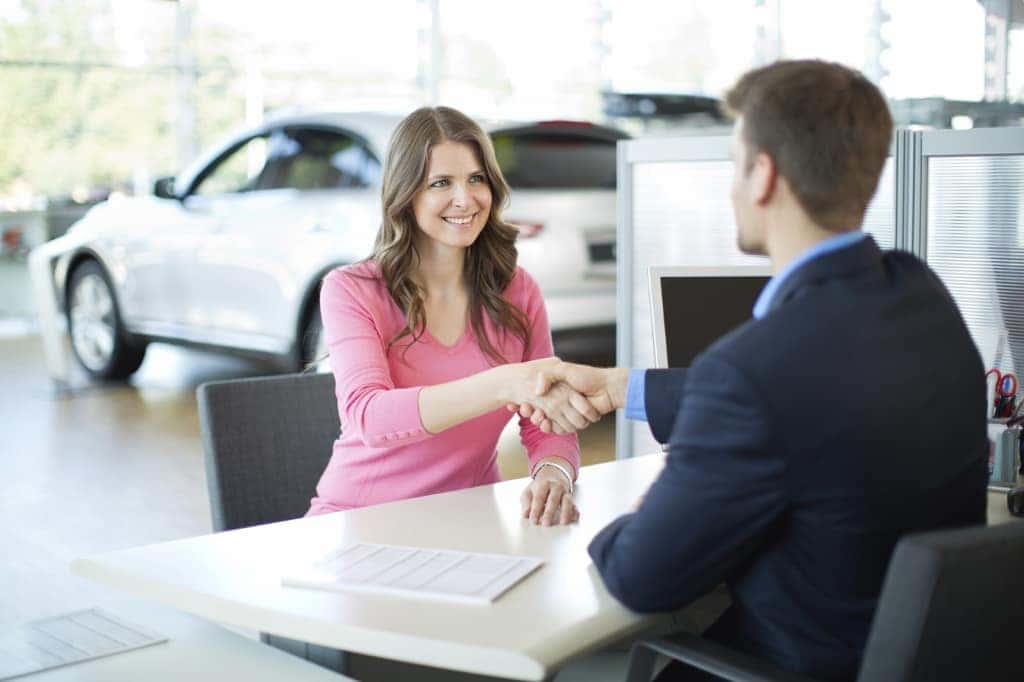 Woman signing deal