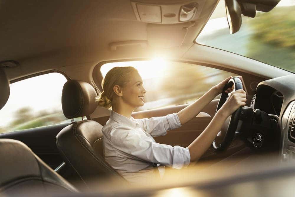 Woman driving Infiniti