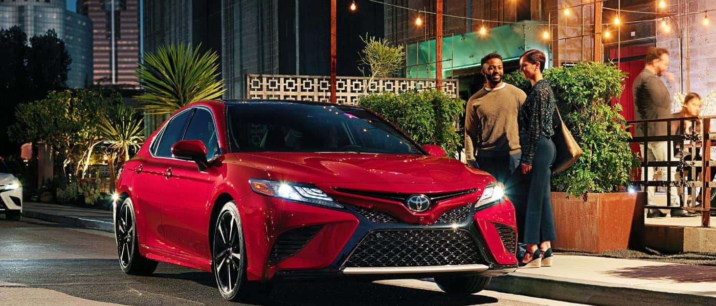 Toyota Camry parked outside restaurant