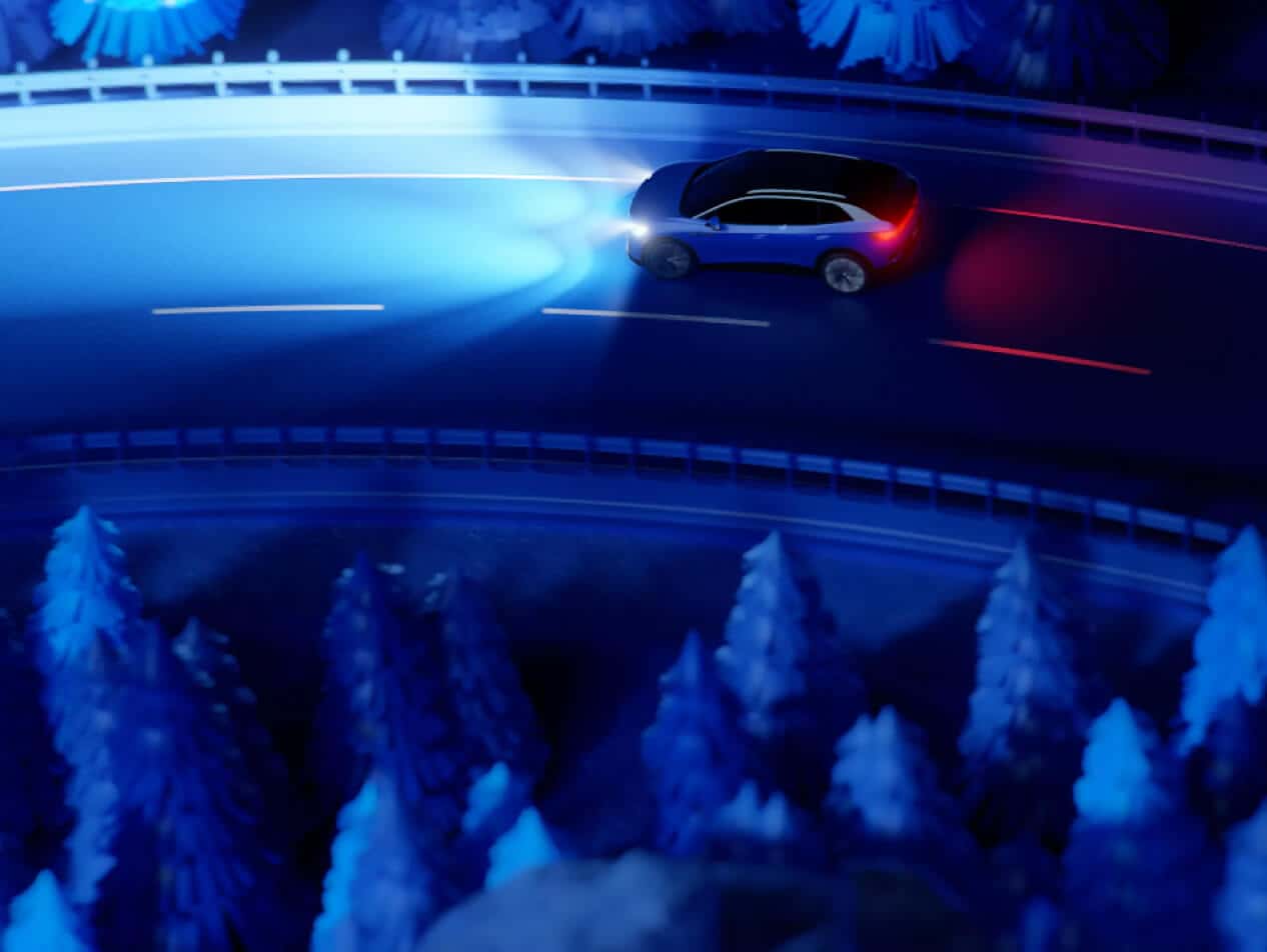 Volkswagen vehicle driving on road at night