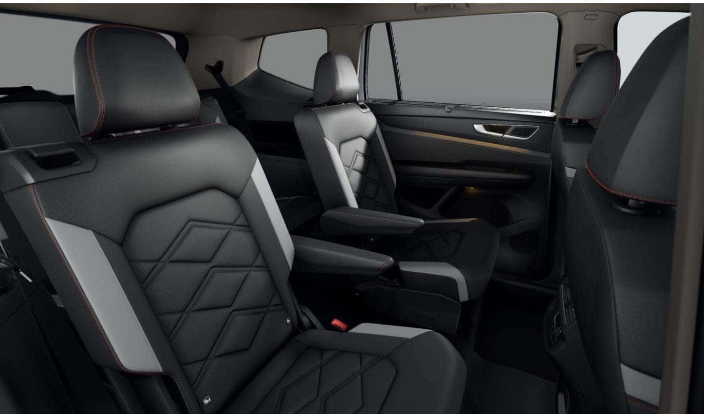 2026 Volkswagen Atlas showcasing two rows of black leather seats with geometric stitching.