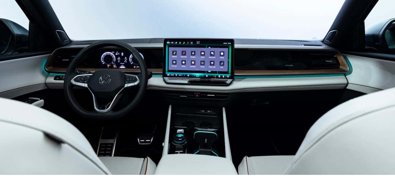 Shetland Beige Leather interior of a 2027 Volkswagen Atlas Premium R-Line showing the dashboard and center touchscreen.