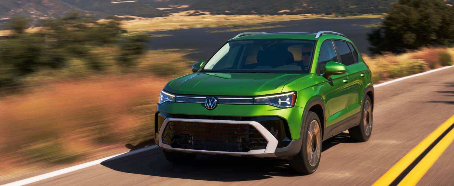 2026 Volkswagen Taos driving on an open road