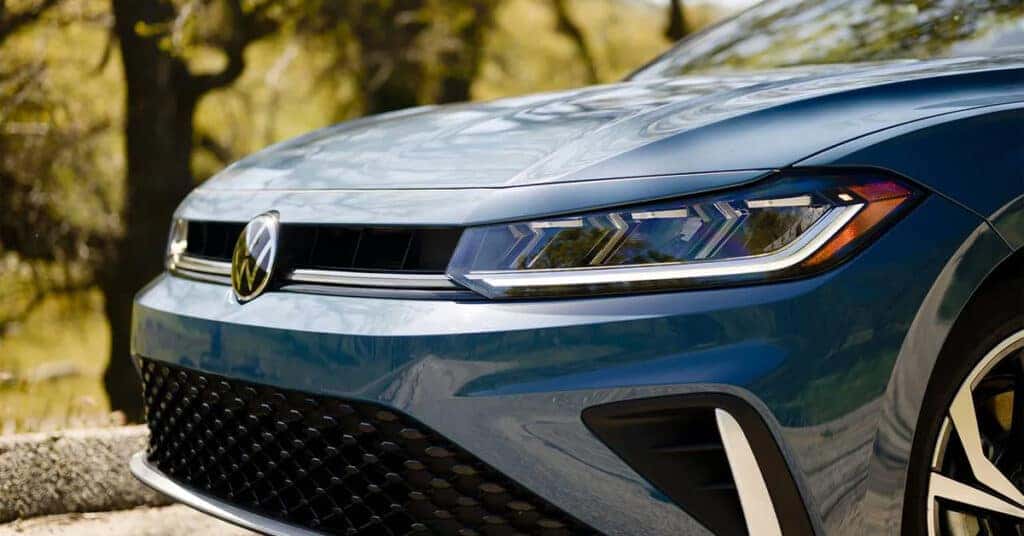 2026 Volkswagen Jetta front grille and headlight close-up outdoors.