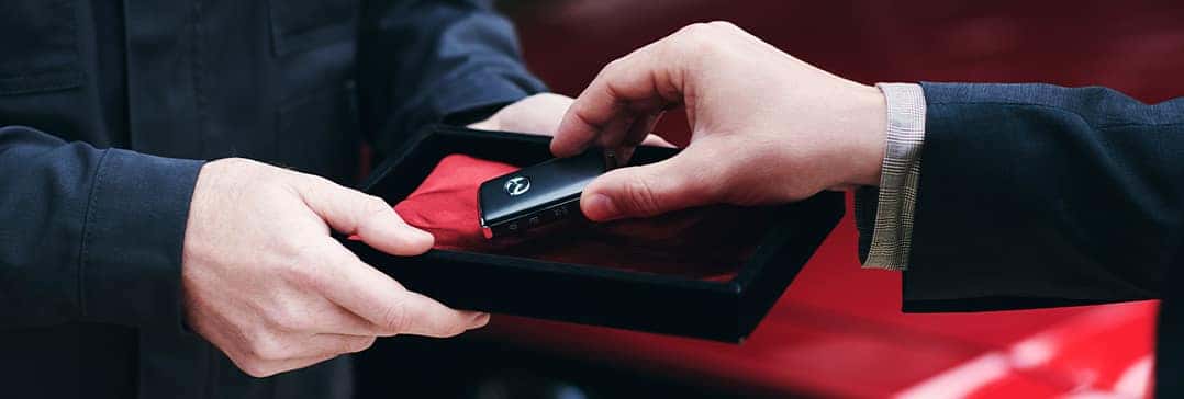 Lancaster Mazda is a Mazda Dealership in Lancaster near Lancaster PA | Handed keys from fancy box
