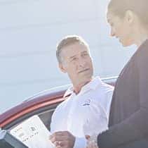 Lancaster Mazda is a Mazda Dealership in Lancaster near Lancaster PA | Close-up of customer going thru paperwork