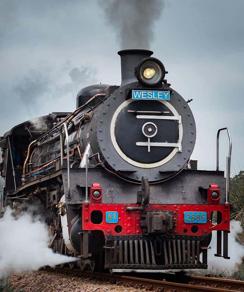 Lancaster Mazda is a Mazda Dealership near York, PA | Black Steam Locomotive with Red Accents Facing Right