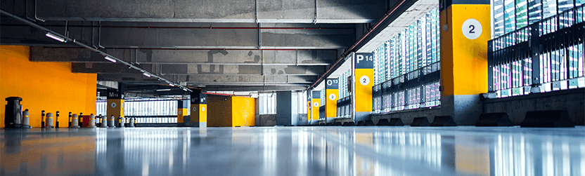 Extend the Life of Your Vehicle at Lancaster Mazda in East Petersburg, PA | Empty indoor parking garage with yellow painted walls 