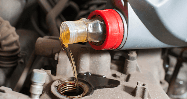How to prepare your Mazda for the winter season in East Petersburg, PA at Lancaster Mazda | New engine oil is being poured into car engine