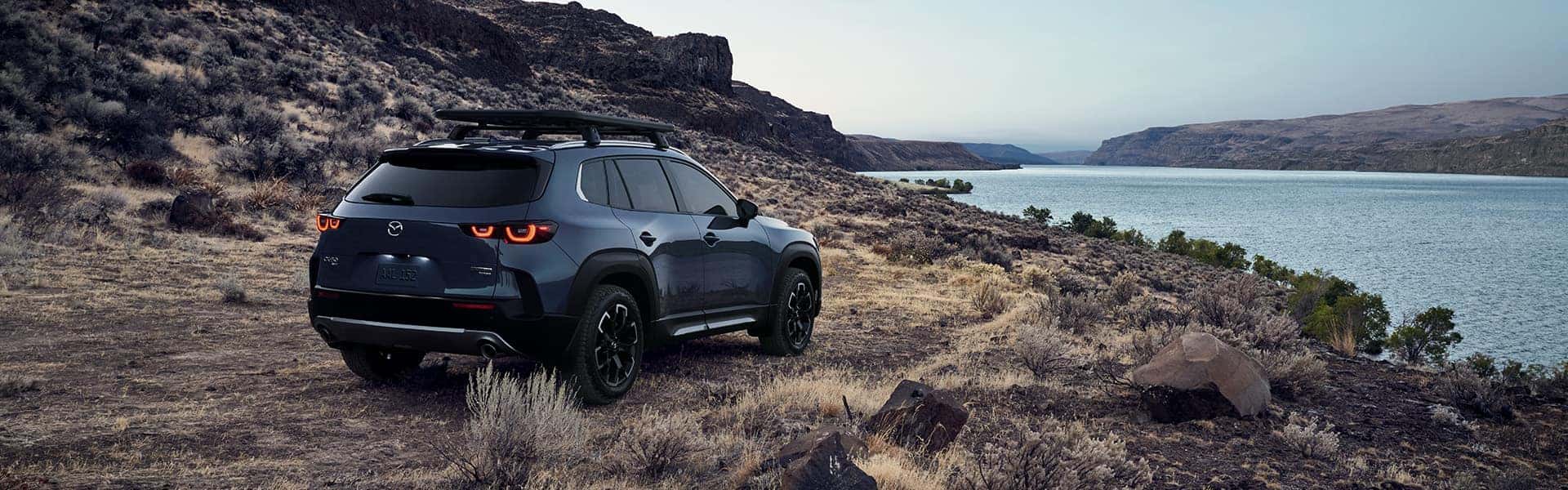 Mazda CX-50 Parked on Dry Grass Covered Lake Overlook | Leasing versus Buying a Mazda at Lancaster Mazda in Lancaster, PA