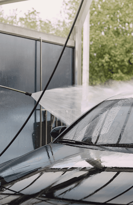 Accessories that help keep your Mazda protected at Lancaster Mazda in East Petersburg, PA | Power washer hose being used to clean the outside of a vehicle 