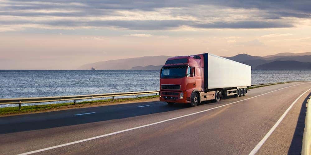 Commercial Truck on Highway Near Lake