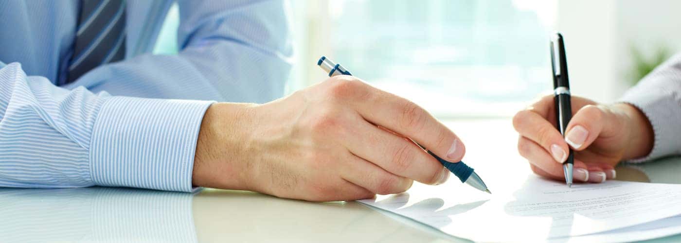 Man and Woman Signing Contract