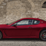 Red GranTurismo Against Stone Wall