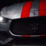 The 2020 Maserati Fuoriserie Corse. It has gray paint with two red racing stripes on the hood.