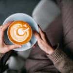 Woman holding a cup of coffee
