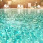 surface of water in pool with light refractions