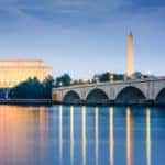 Washington DC, USA skyline on the Potomac River with Lincoln Memorial, Washington Monument, and Arlington Memorial Bridge.