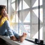 A young woman drinking coffee on a calm morning