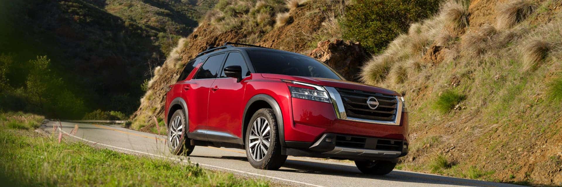 red 2025 pathfinder driving on road