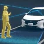 Illustration of Nissan Automatic Emergency Braking with Pedestrian Detection identifying a pedestrian in front of a vehicle