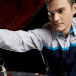 Mazda technician pouring oil into oil filter