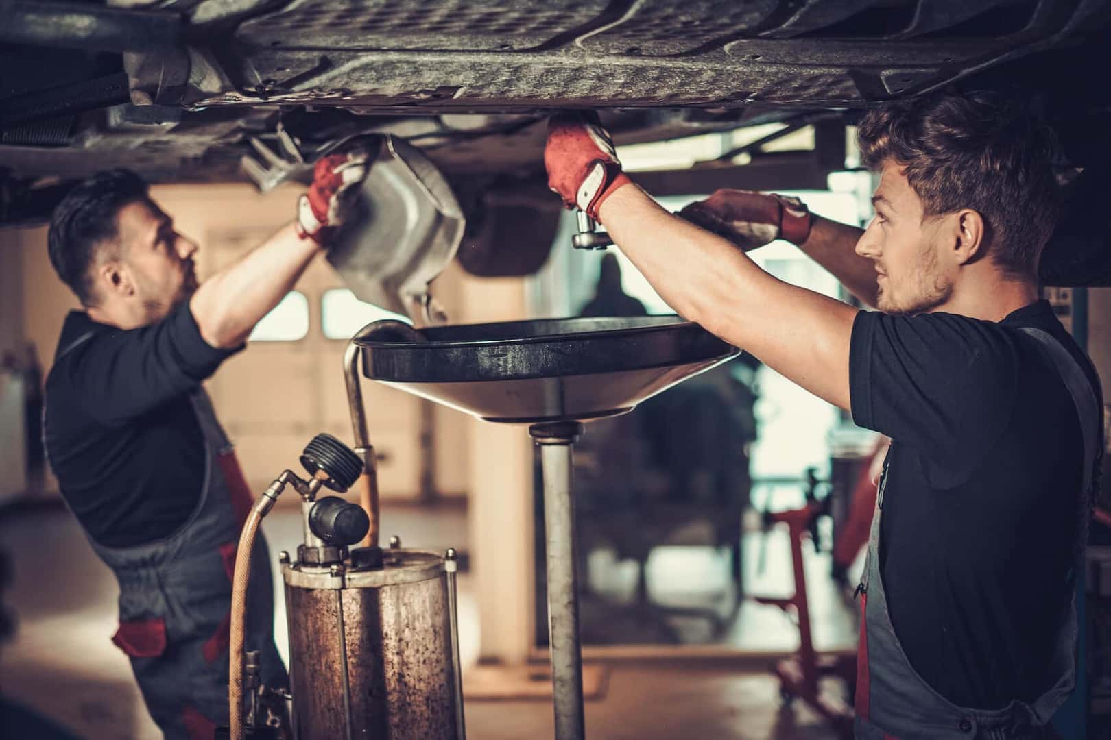 Mechanics Changing Oil In Car