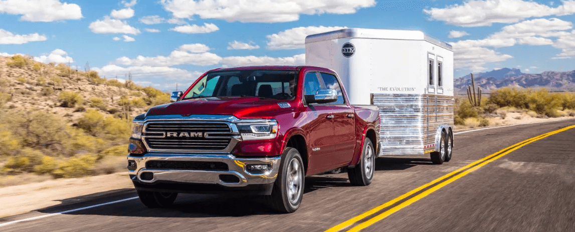 All-New 2019 Red RAM 1500 Towing A Trailer