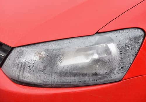 Flood damaged cars tend to have excess moisture in headlights.