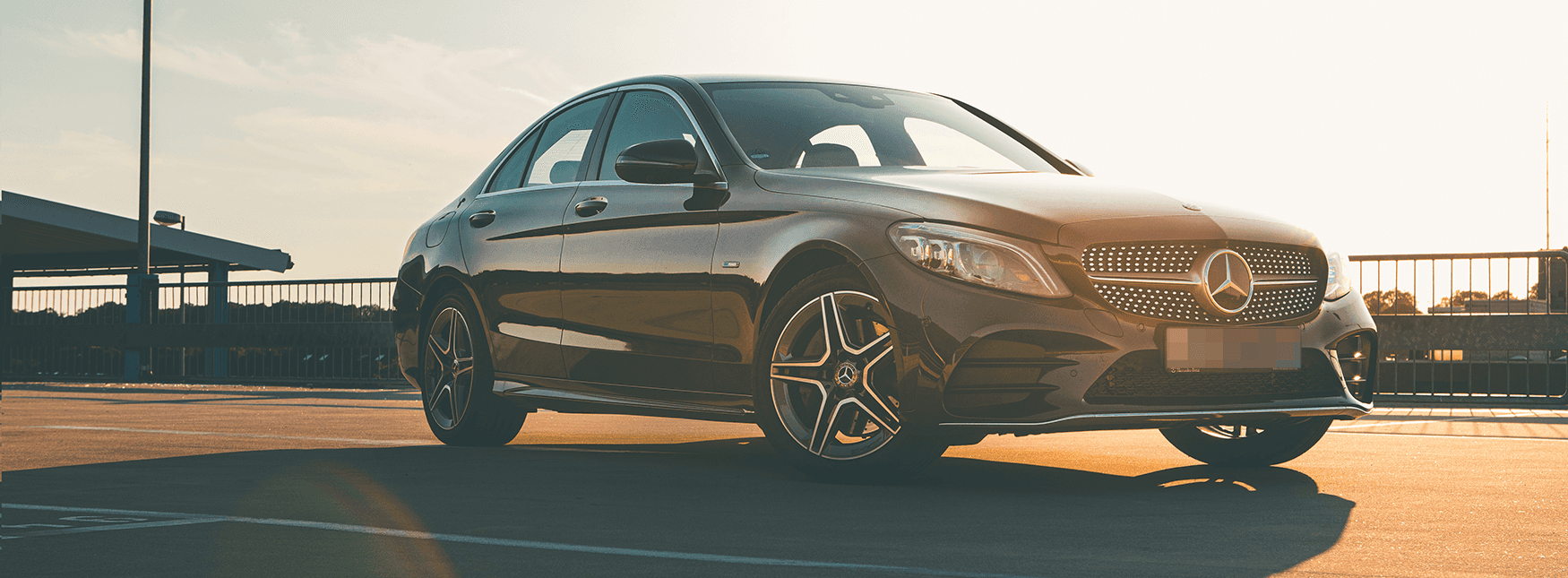 Mercedes Benz reflecting the sun