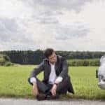 Man Beside Broken Down Car