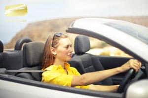 The woman buying a car at the dealership