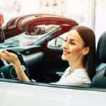 A man handing over the keys of a car