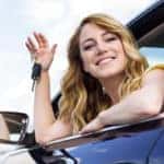 The key of a car in a woman’s hand