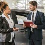 Customer buying a used car at a dealership