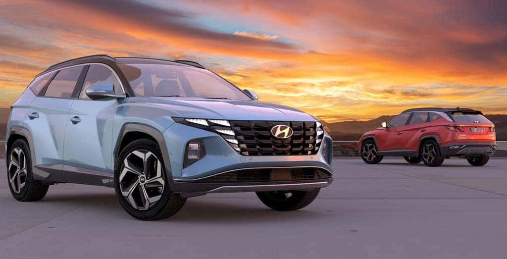 Used Hyundai Tucson SUV parked outdoors, showcasing its sleek design and durability, against the backdrop of a stunning sunrise.