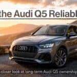 Is the Audi Q5 Reliable banner featuring a modern Audi Q5 luxury SUV at sunset with the message “What owners should know before buying.”