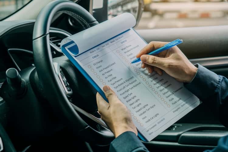 Reviewing service records and vehicle history documentation