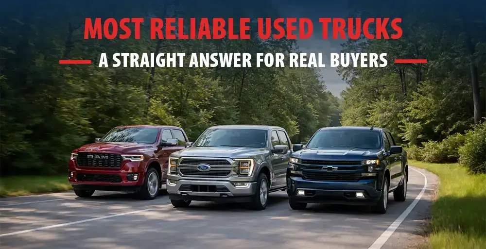 Lineup of three used trucks on the road