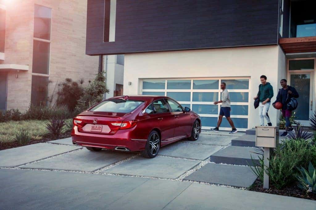 2021 Honda Accord Touring sedan red in driveway teen boys