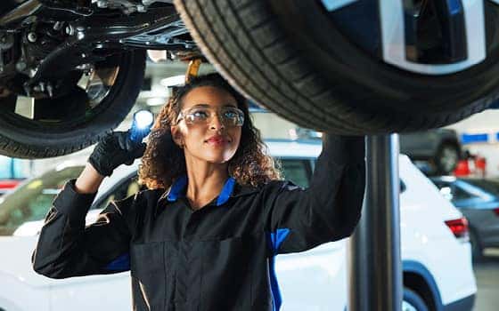 Volkswagen technician checking car