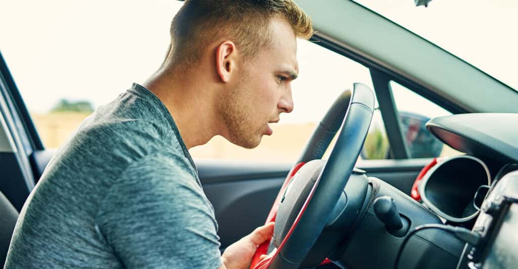 Person in car listening for noises